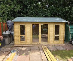 Bespoke timber garden building with glazed doors built by Cullompton Carpenters in Devon