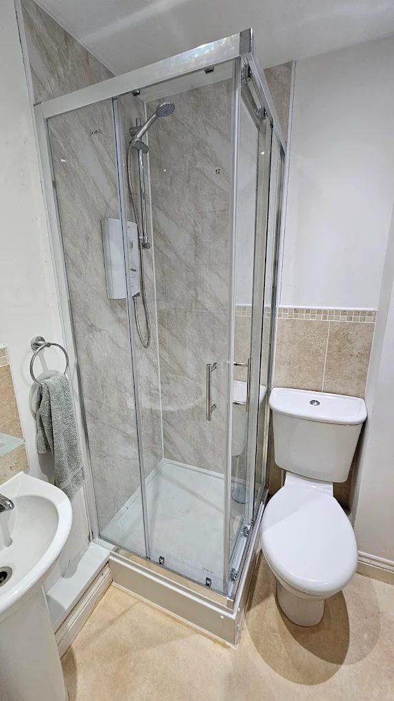 Bathroom renovation with walk-in shower enclosure and tiling in Mid Devon